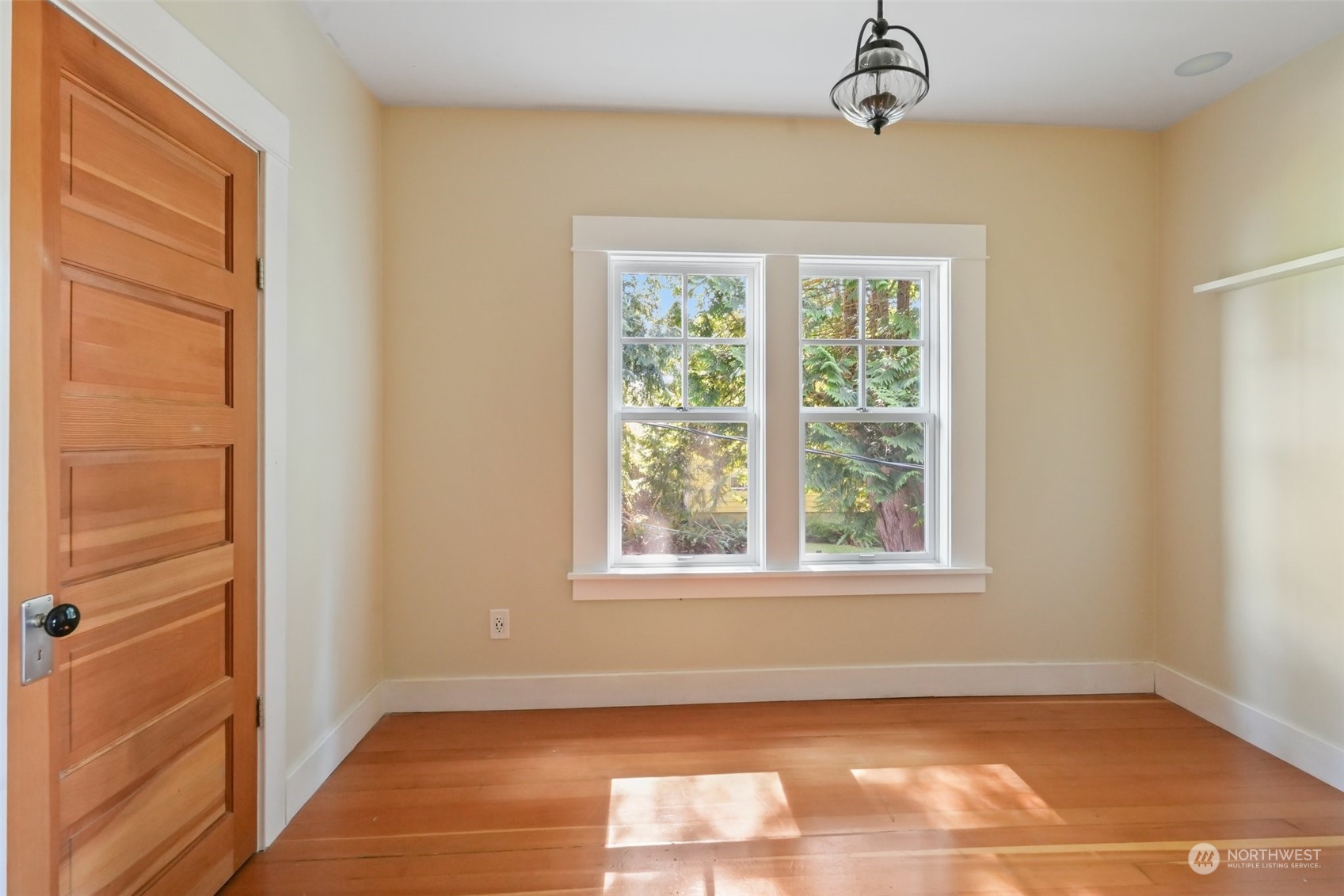 1702 North Pine Street Tacoma, WA 98406 - Photo 23 of 27 a view of an empty room with wooden floor and a window