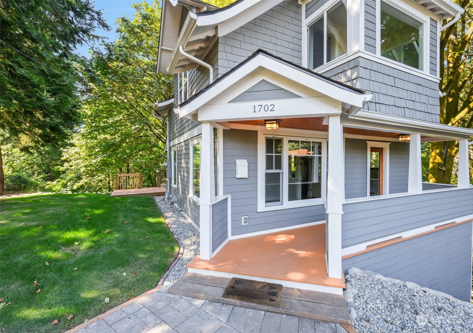 1702 North Pine Street Tacoma, WA 98406 - Photo 3 of 27 a front view of a house with a yard