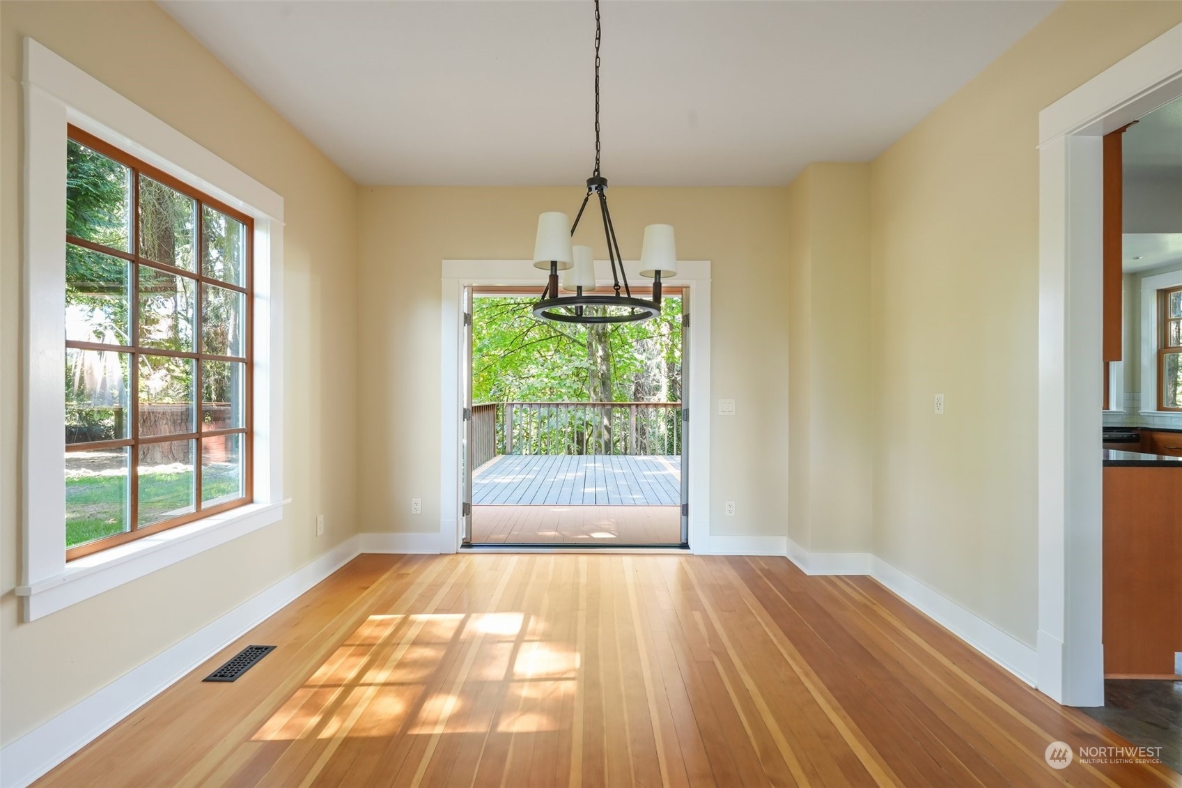 1702 North Pine Street Tacoma, WA 98406 - Photo 8 of 27 a view of empty room with wooden floor and fan