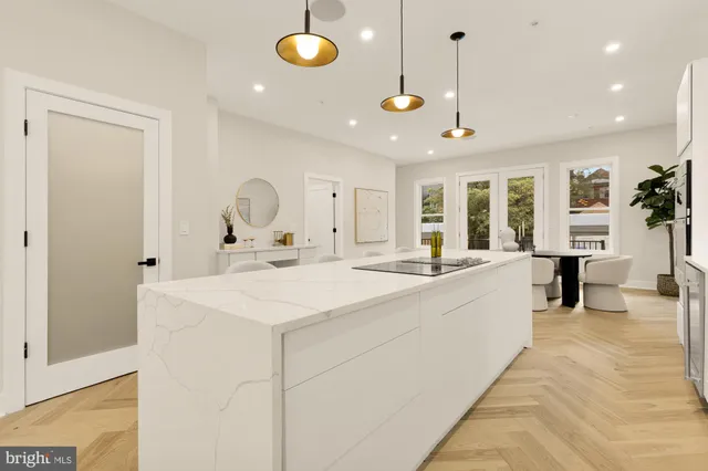a kitchen with a dining table and chairs