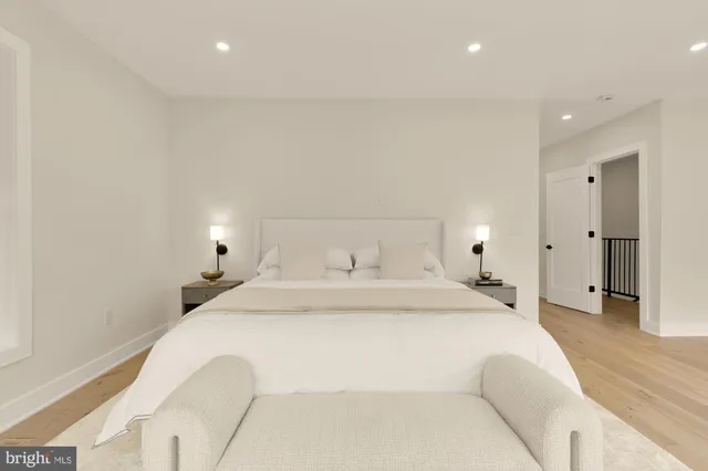 a bedroom with a bed and a couch