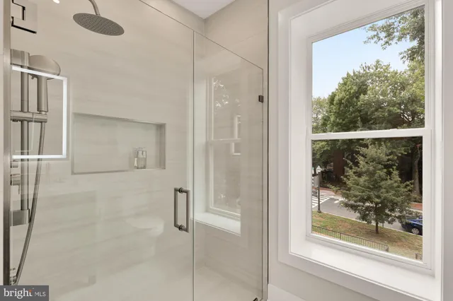 a front view of a house with large windows