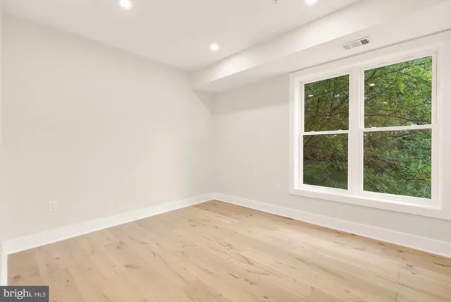 a view of house with backyard and sitting area
