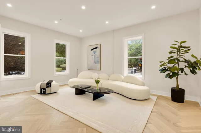 a living room with furniture and a table