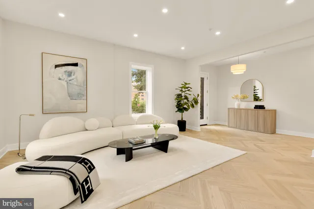 a kitchen with a table chairs refrigerator and microwave