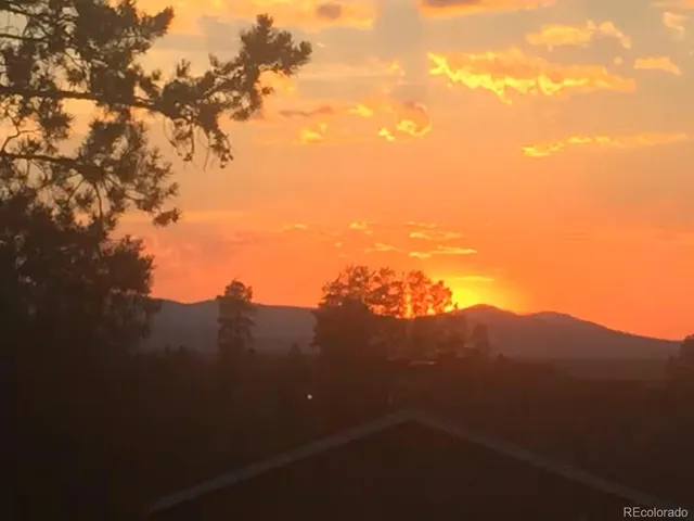 a view of a mountain range with a mountain