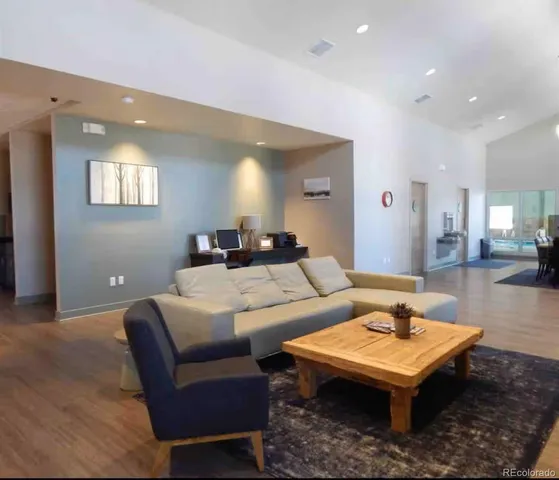 a living room with furniture and a table