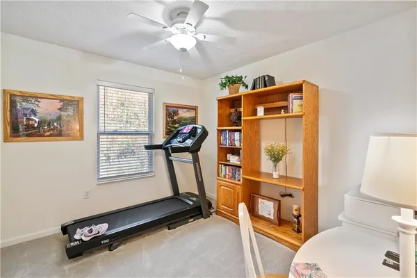 a room with gym equipment and a window