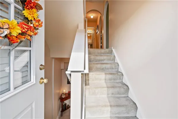 a view of a hallway with staircase