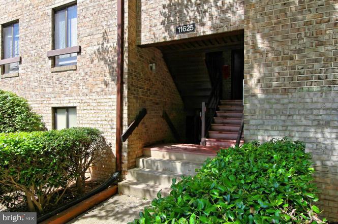11625 Stoneview Square, Unit 2B Reston, VA 20191 - Photo 1 of 21 a view of front door of house with stairs