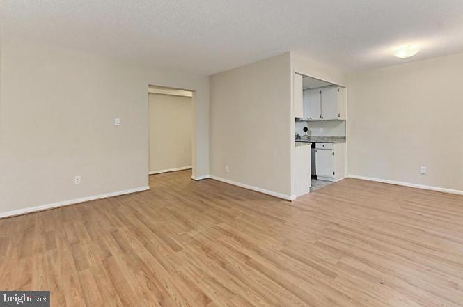 11625 Stoneview Square, Unit 2B Reston, VA 20191 - Photo 7 of 21 a view of a kitchen with wooden floor and a sink