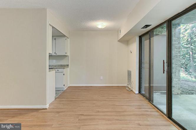 11625 Stoneview Square, Unit 2B Reston, VA 20191 - Photo 8 of 21 a view of a kitchen from the hallway