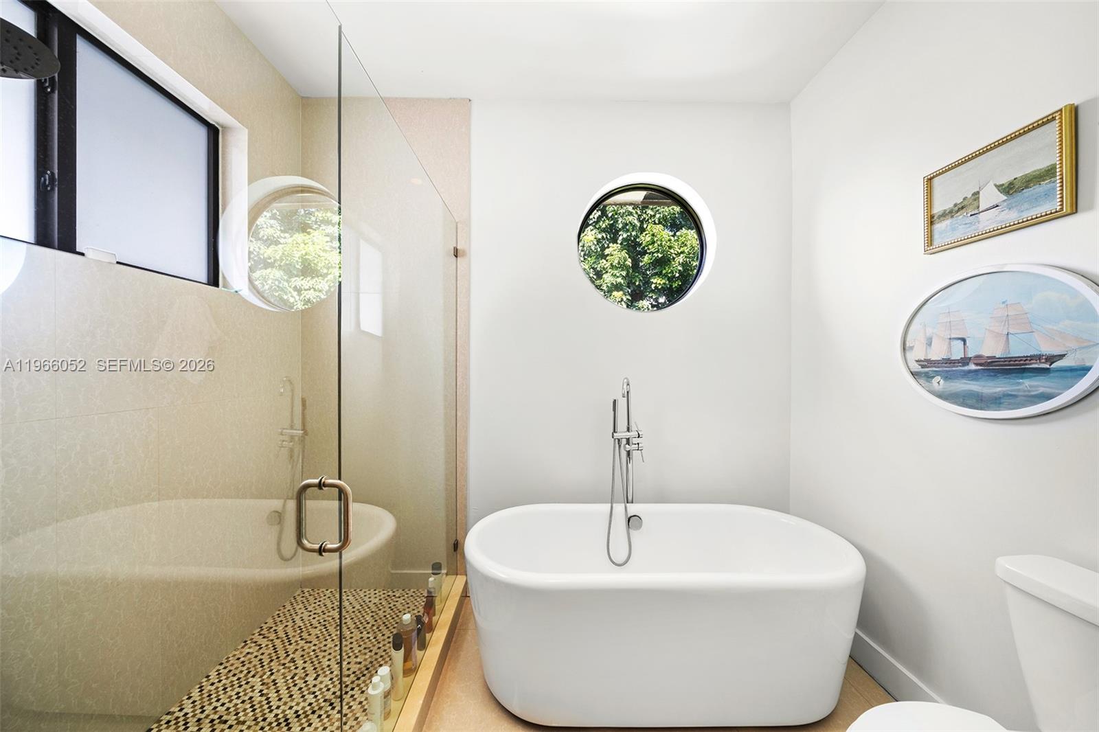 6001 Southwest 28th Street Miami, FL 33155 - Photo 20 of 30 a bathroom with a sink a bathtub and a shower