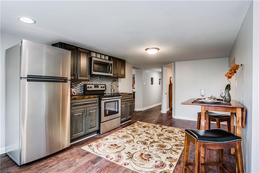 34 Churchill Road Pittsburgh, PA 15235 - Photo 22 of 25 The Equipped Lower Level Eat In Kitchen with Tile Back Splash is a Welcome Space.