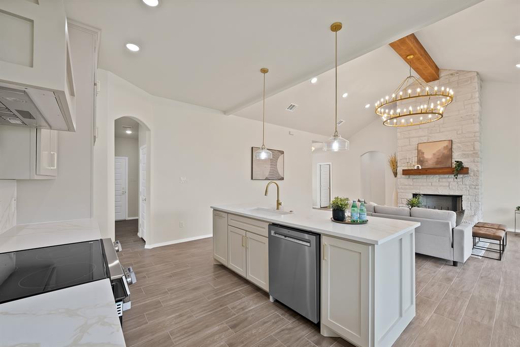 501 Harris Road Azle, TX 76020 - Photo 4 of 29 a kitchen with a sink appliances and cabinets