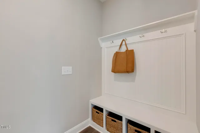 a view of a dining room with furniture large windows and wooden floor