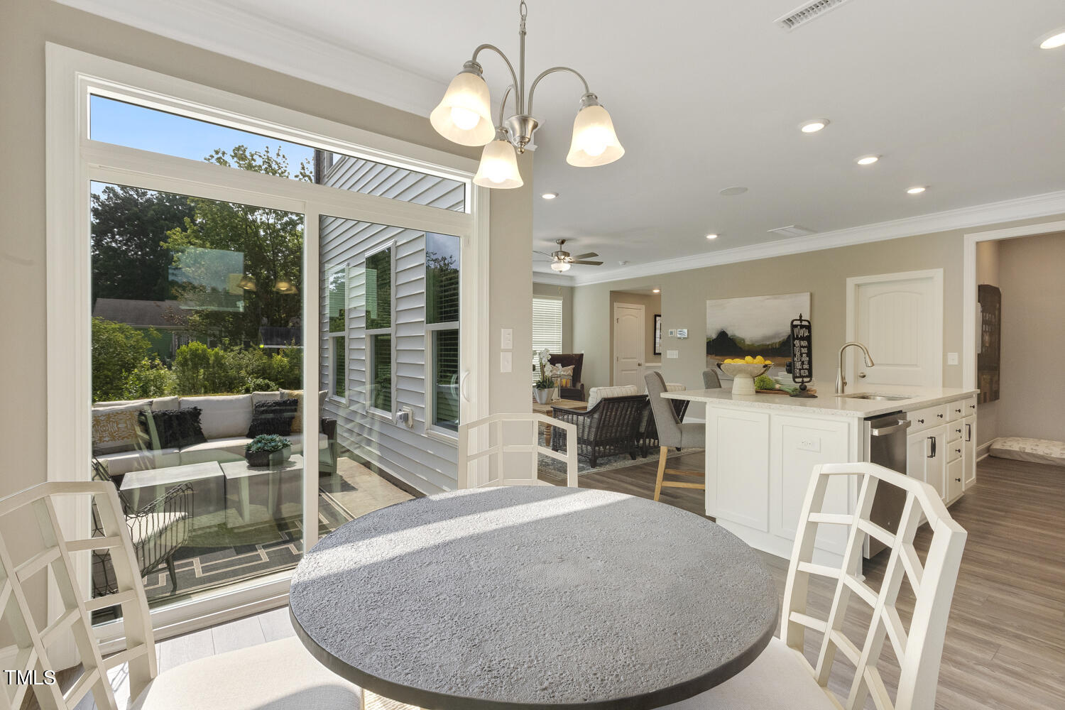 3455 Piedmont Drive Raleigh, NC 27604 - Photo 19 of 47 a view of a dining room with furniture large windows and wooden floor