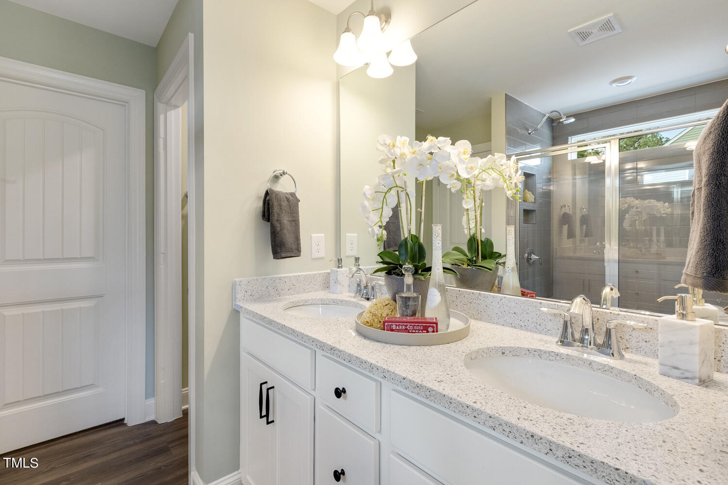 3455 Piedmont Drive Raleigh, NC 27604 - Photo 27 of 47 a bathroom with a double vanity sink and a mirror