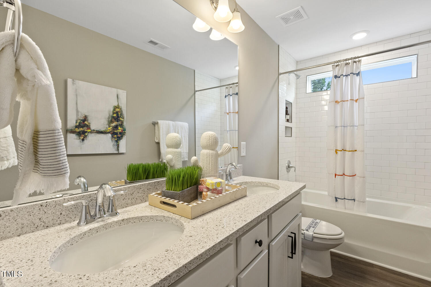 3455 Piedmont Drive Raleigh, NC 27604 - Photo 35 of 47 a bathroom with a granite countertop sink a toilet and shower