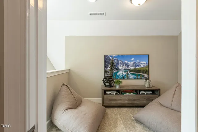 a bedroom with a bed and ceiling fan