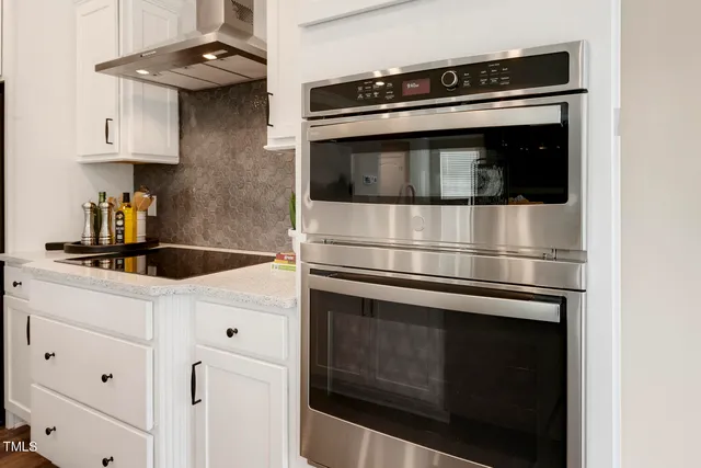 a kitchen with counter top space cabinets and stainless steel appliances