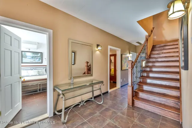 a view of a livingroom with furniture and staircase