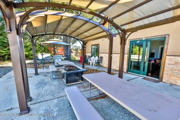 a view of a chairs and table in the patio