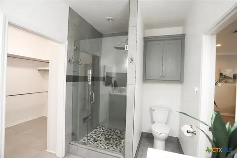 a bathroom with a sink and toilet