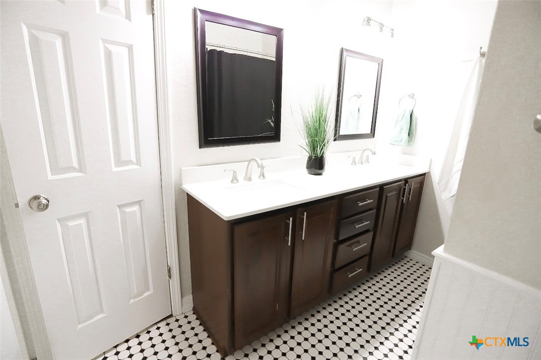 1701 Sulpher Wells Road Salado, TX 76571 - Photo 21 of 34 a bathroom with a sink and a mirror