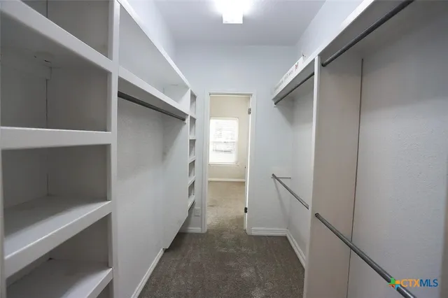 a backyard of a house with barbeque oven