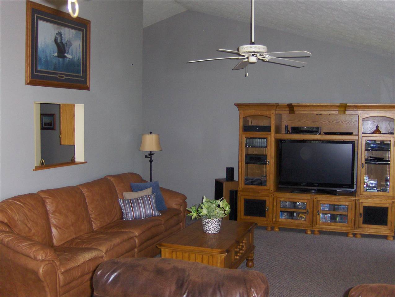 606 Berglund Road Pecatonica, IL 61063 - Photo 6 of 20 a living room with furniture and a flat screen tv