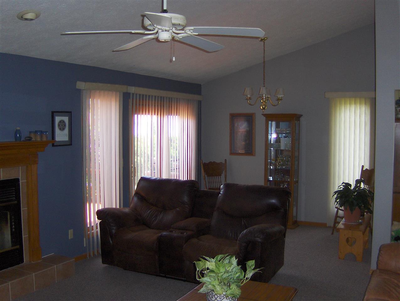 606 Berglund Road Pecatonica, IL 61063 - Photo 8 of 20 a living room with furniture and a chandelier