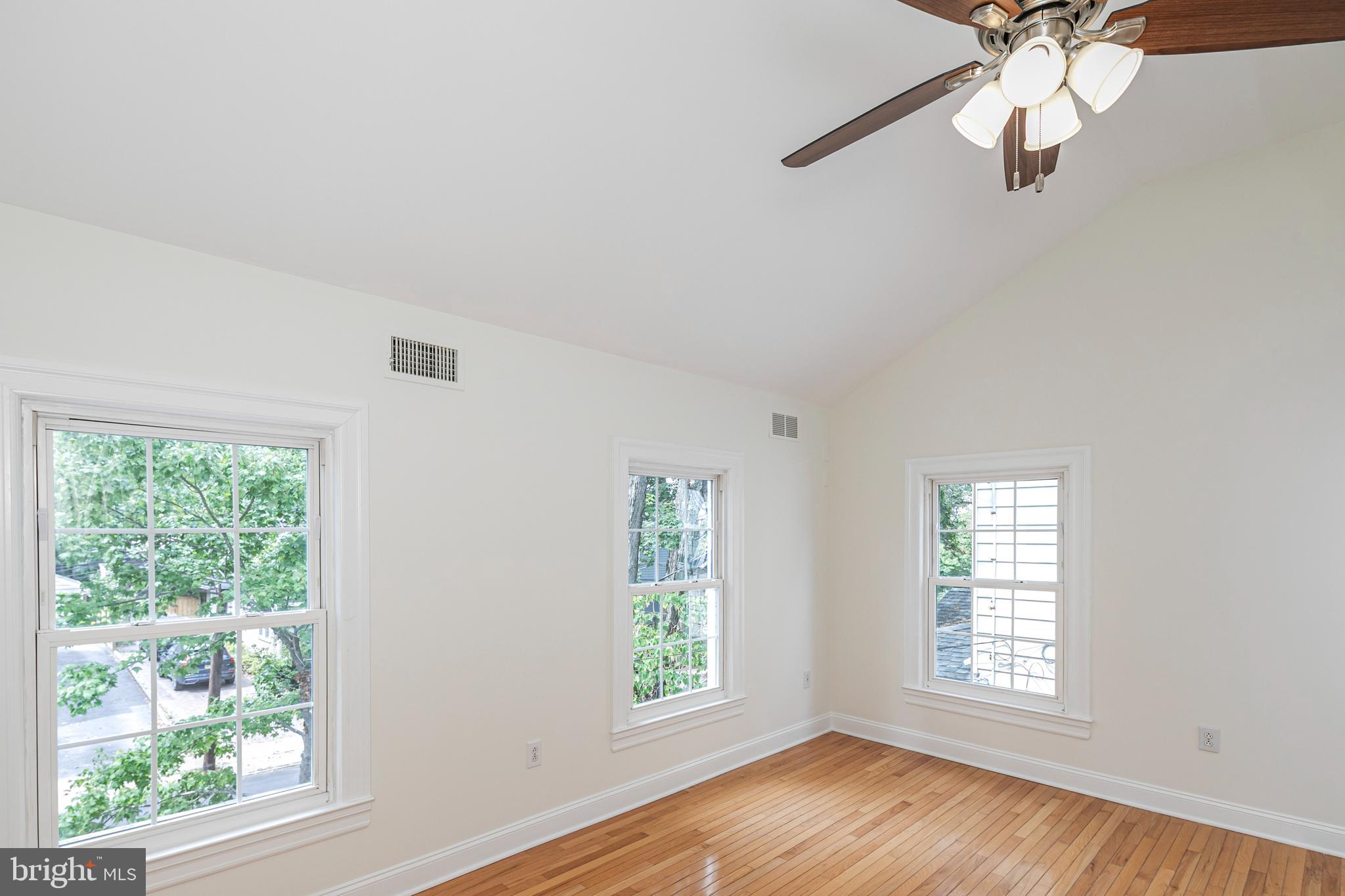 35 Maple Street Princeton, NJ 08542 - Photo 23 of 35 a view of an empty room with a window and wooden floor