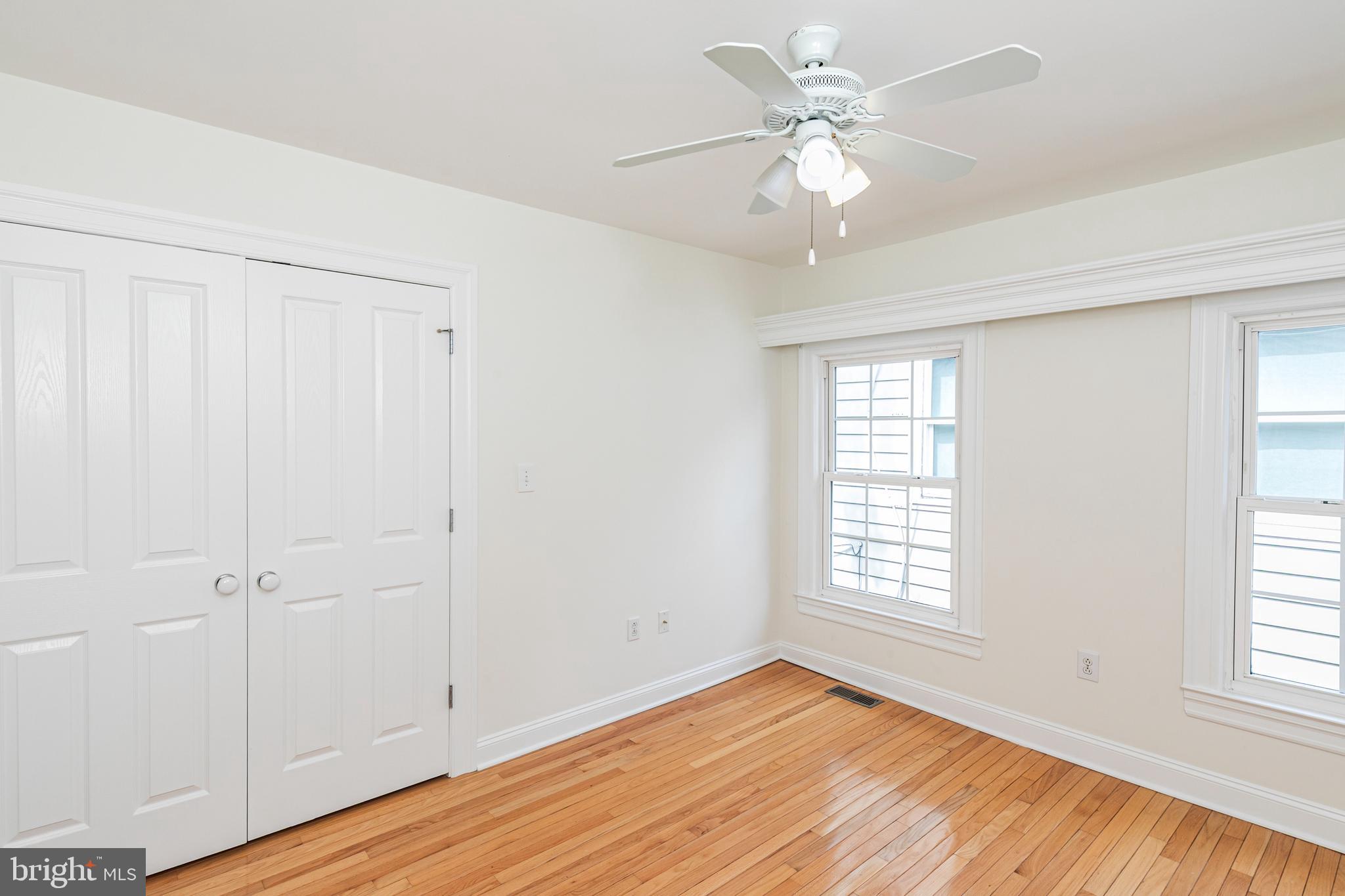 35 Maple Street Princeton, NJ 08542 - Photo 26 of 35 a view of an empty room with a window and wooden floor