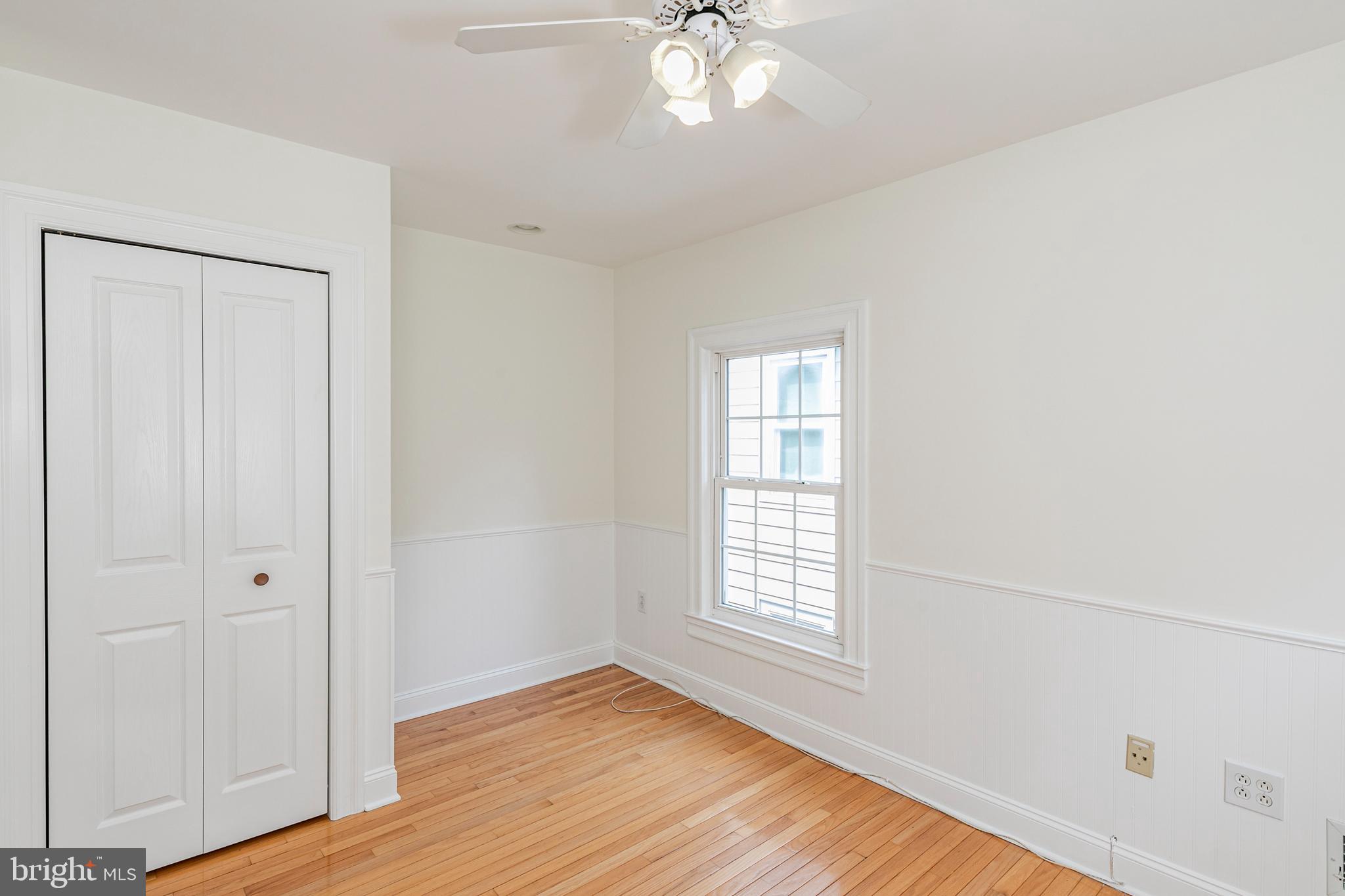 35 Maple Street Princeton, NJ 08542 - Photo 27 of 35 an empty room with wooden floor and windows