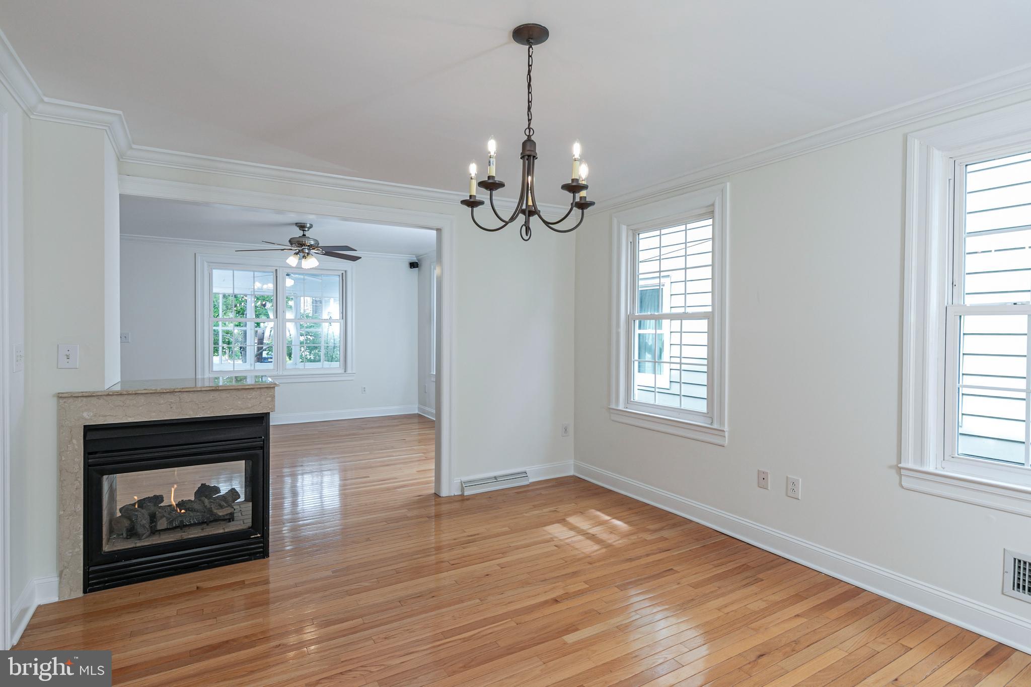 35 Maple Street Princeton, NJ 08542 - Photo 9 of 35 a view of an empty room with wooden floor fireplace and a window