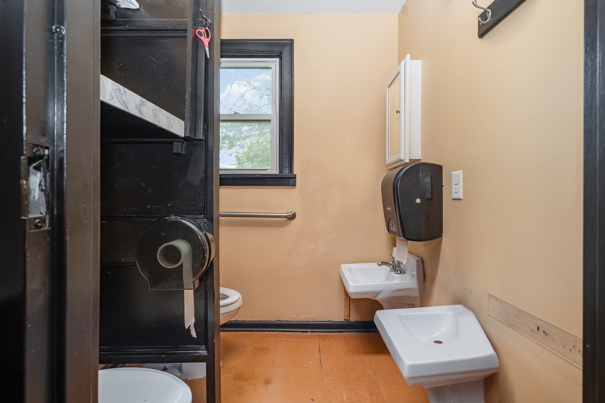 2003 Lebanon Pike Nashville, TN 37210 - Photo 13 of 26 a bathroom with a toilet a sink and mirror