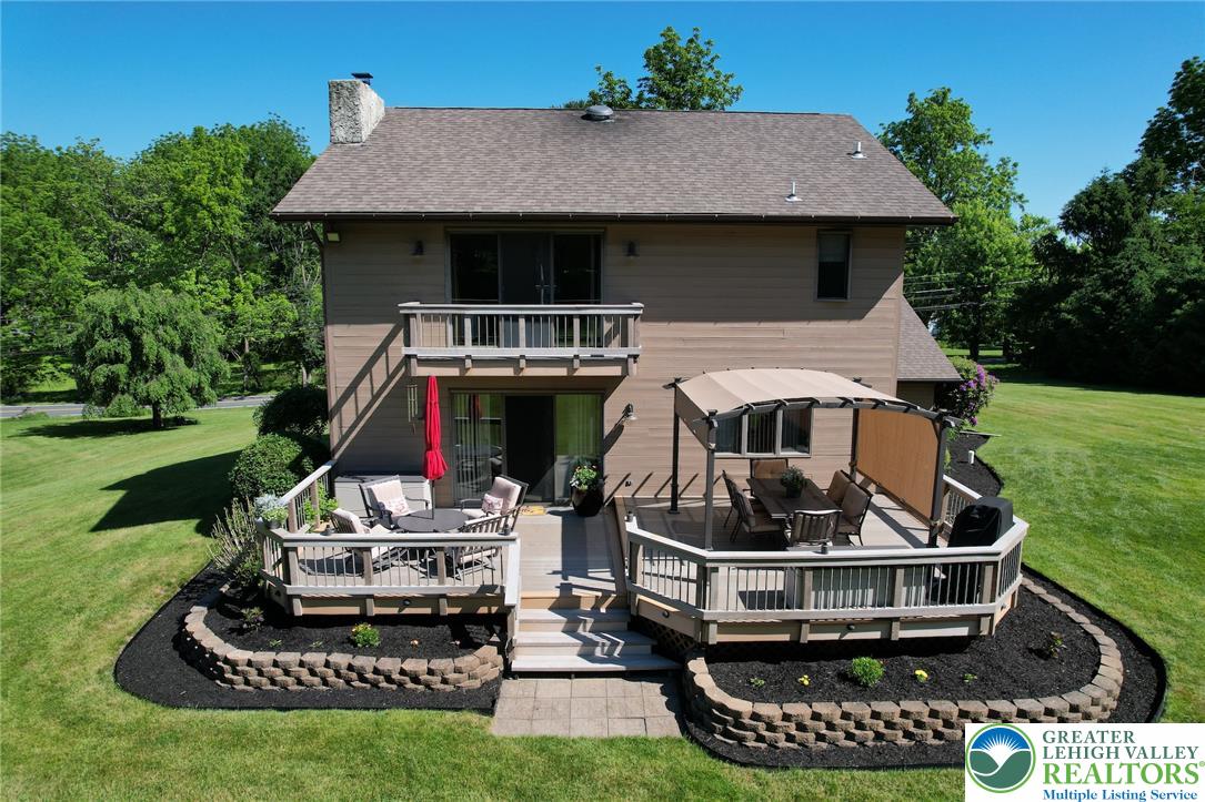 3470 Brodhead Road Bethlehem, PA 18020 - Photo 14 of 84 A spacious multi-level deck offers diverse outdoor living options, overlooking a verdant lawn.