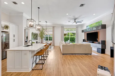 a kitchen with stainless steel appliances a refrigerator sink and cabinets