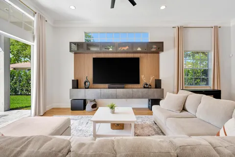 a spacious bedroom with a bed and a large window