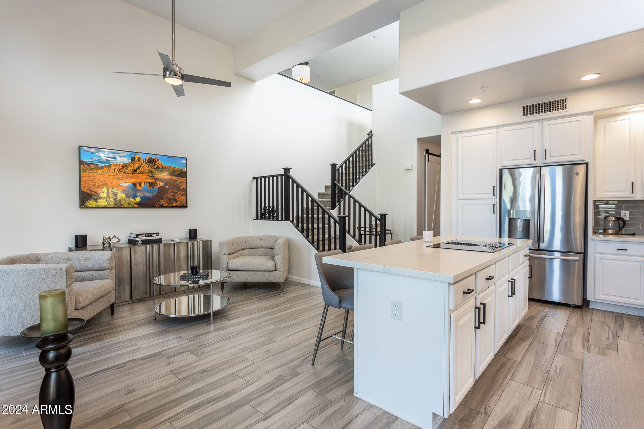 28990 North White Feather Lane, Unit 168 Scottsdale, AZ 85262 - Photo 9 of 36 a open kitchen with stainless steel appliances granite countertop a stove and a refrigerator