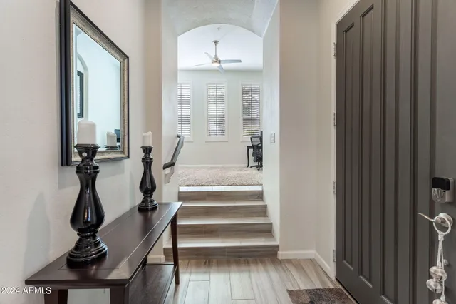 a open kitchen with stainless steel appliances granite countertop a stove and a refrigerator