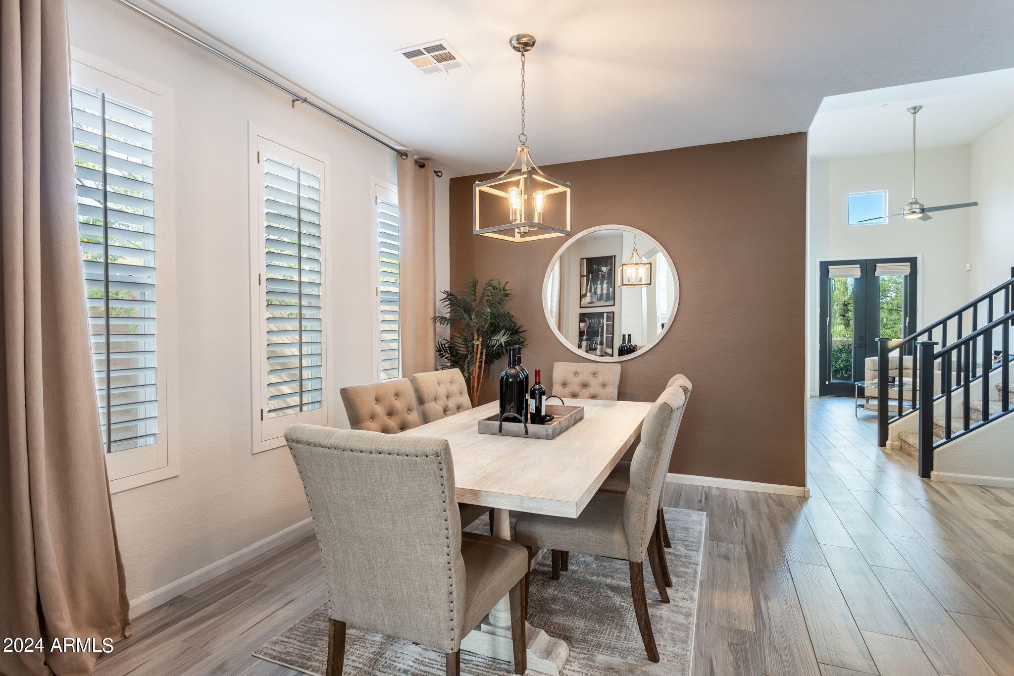 28990 North White Feather Lane, Unit 168 Scottsdale, AZ 85262 - Photo 11 of 36 a view of a dining room with furniture window and wooden floor