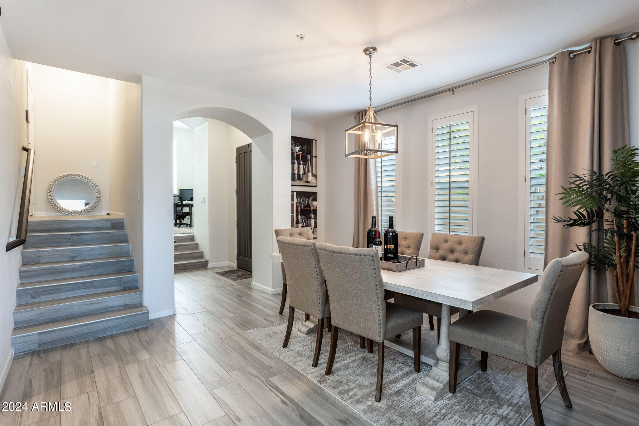 28990 North White Feather Lane, Unit 168 Scottsdale, AZ 85262 - Photo 12 of 36 a view of a dining room with furniture window and wooden floor