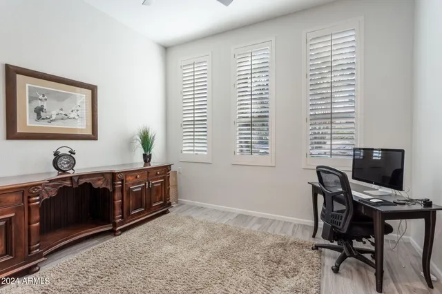 a view of a livingroom with furniture and a fireplace