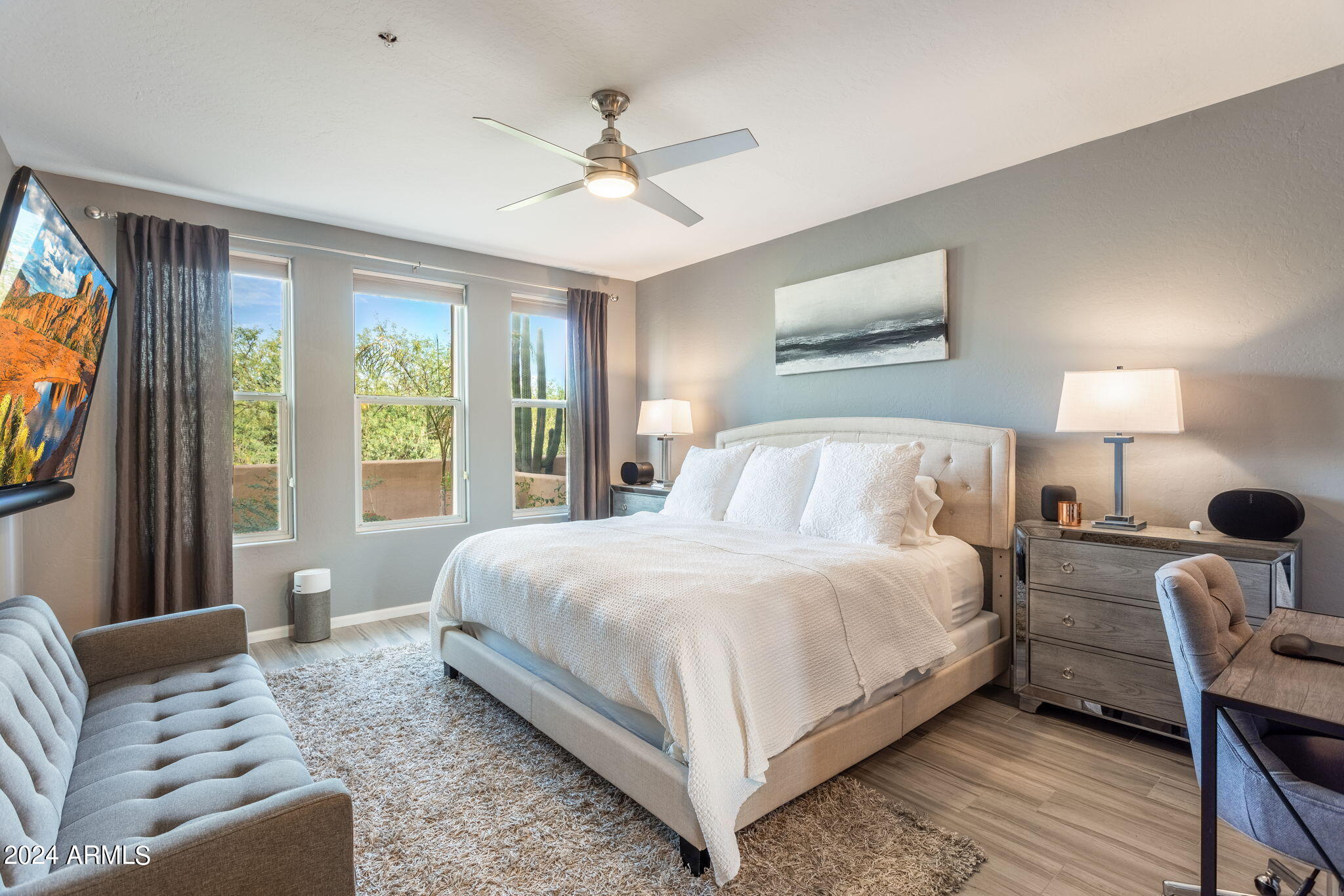 28990 North White Feather Lane, Unit 168 Scottsdale, AZ 85262 - Photo 15 of 36 a bedroom with a large bed and a window