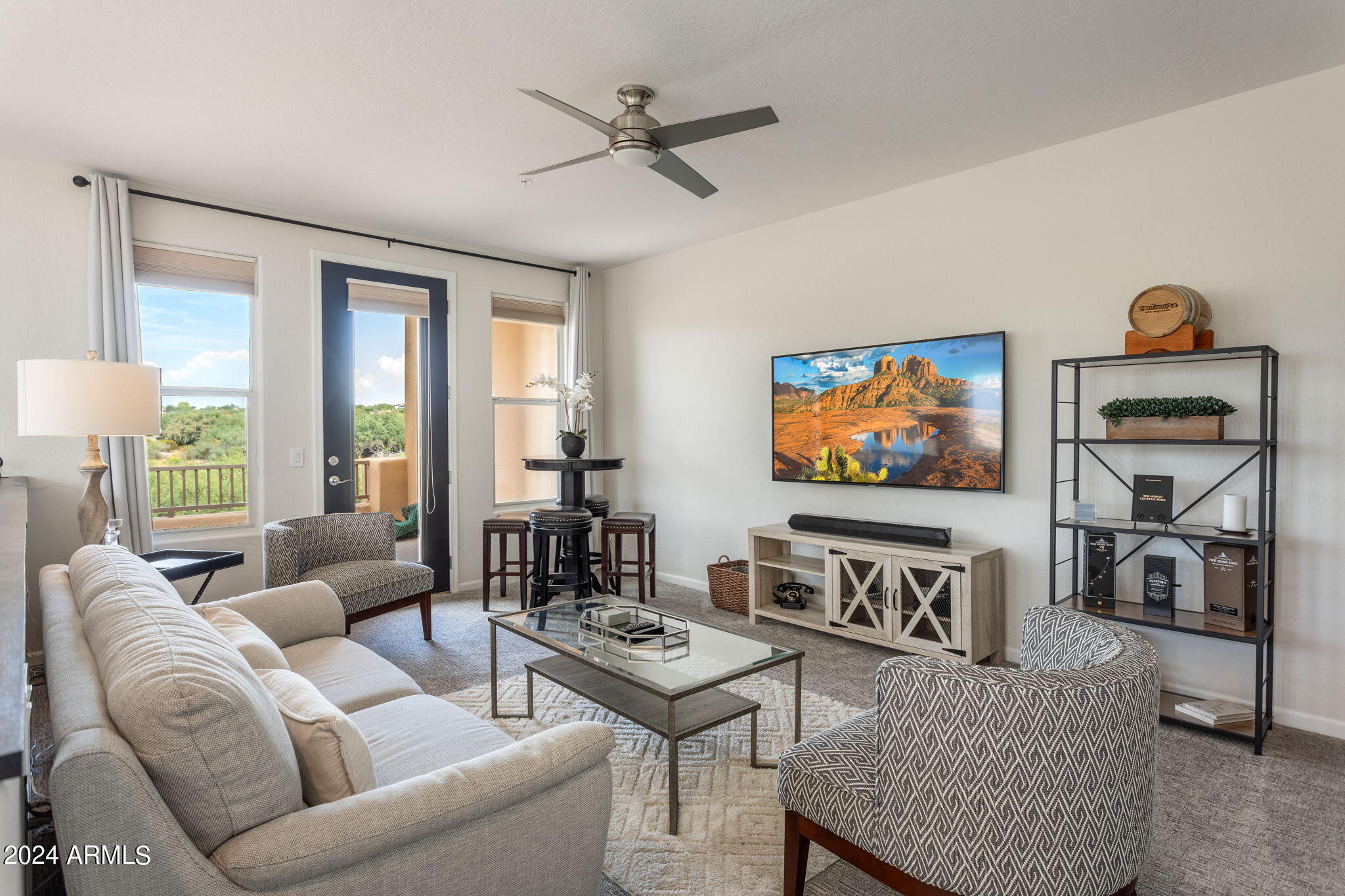 28990 North White Feather Lane, Unit 168 Scottsdale, AZ 85262 - Photo 19 of 36 a living room with furniture and a flat screen tv with wooden floor