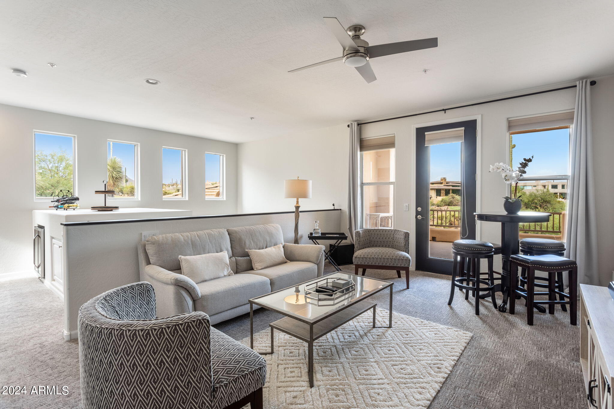 28990 North White Feather Lane, Unit 168 Scottsdale, AZ 85262 - Photo 21 of 36 a living room with furniture and a large window