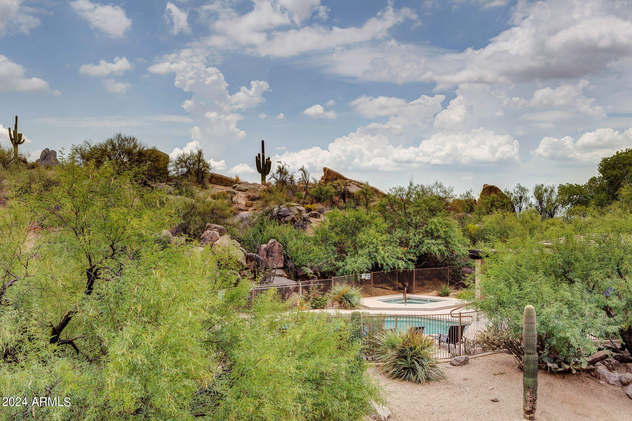 28990 North White Feather Lane, Unit 168 Scottsdale, AZ 85262 - Photo 27 of 36 a view of a fountain in middle of the green field