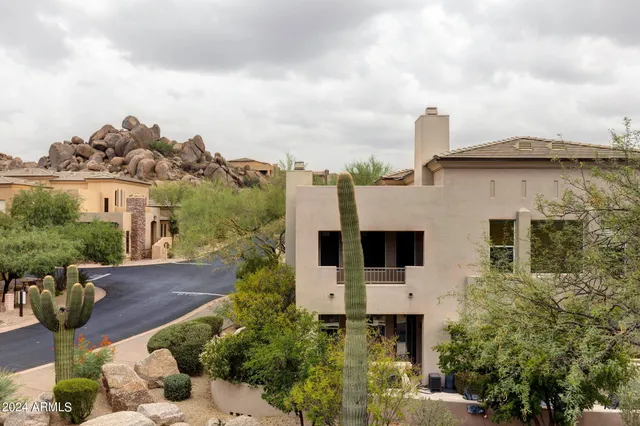an outdoor space with swimming pool and furniture